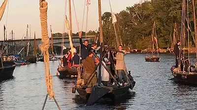 Traditional Loire boats with square sails, passengers on board
